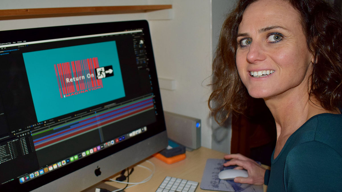 Jane Lyons editor and animator, creating motion graphics in Adobe After Effects in the video garage studio suite.